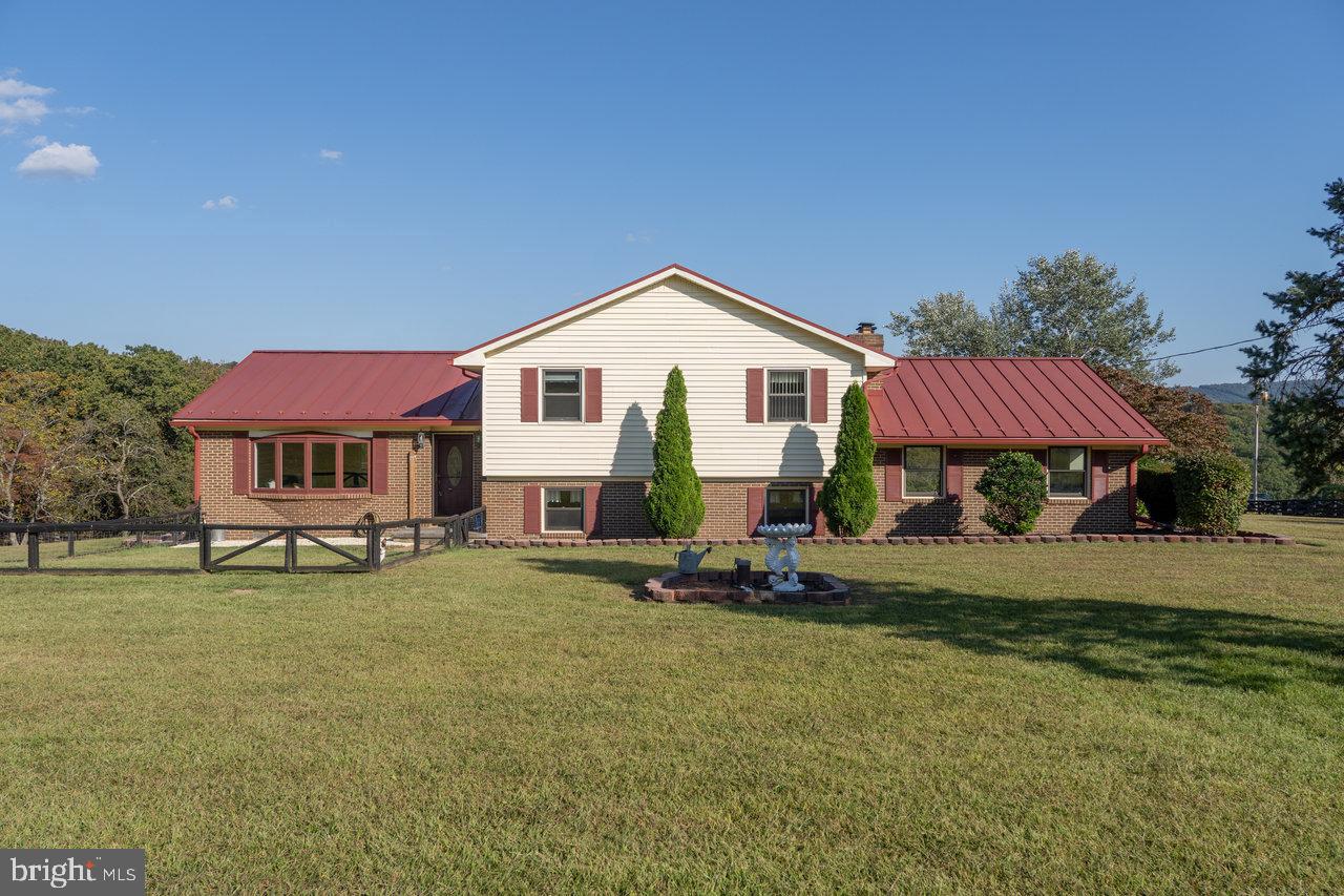 212 Whitacre Road Gore, VA 22637 - Photo 99 of 100 a view of a house with backyard and sitting area