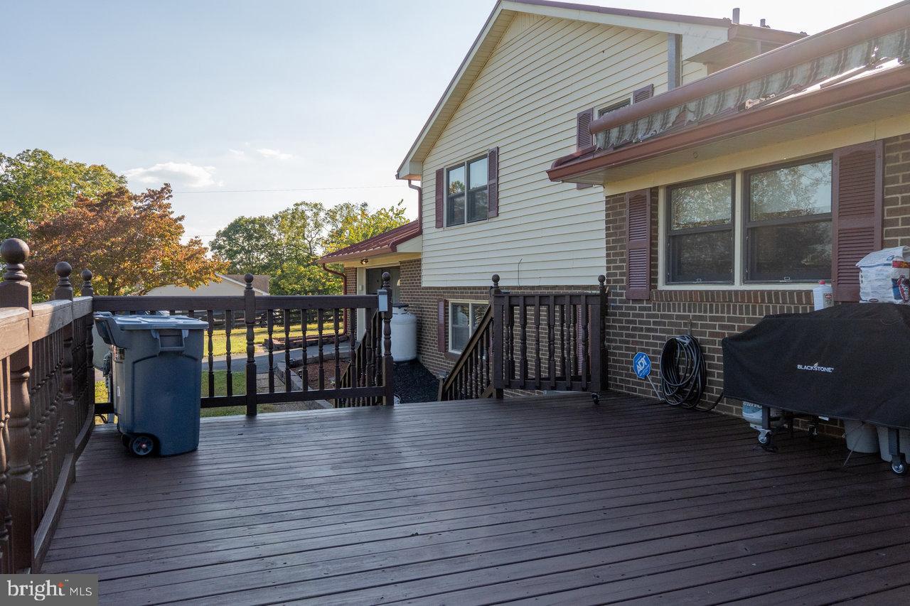 212 Whitacre Road Gore, VA 22637 - Photo 10 of 100 a view of a house with barbeque and wooden floor