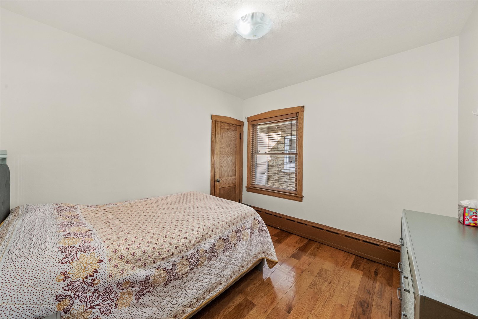 2716 Grove Avenue Berwyn, IL 60402 - Photo 12 of 46 a bedroom with a bed and a window