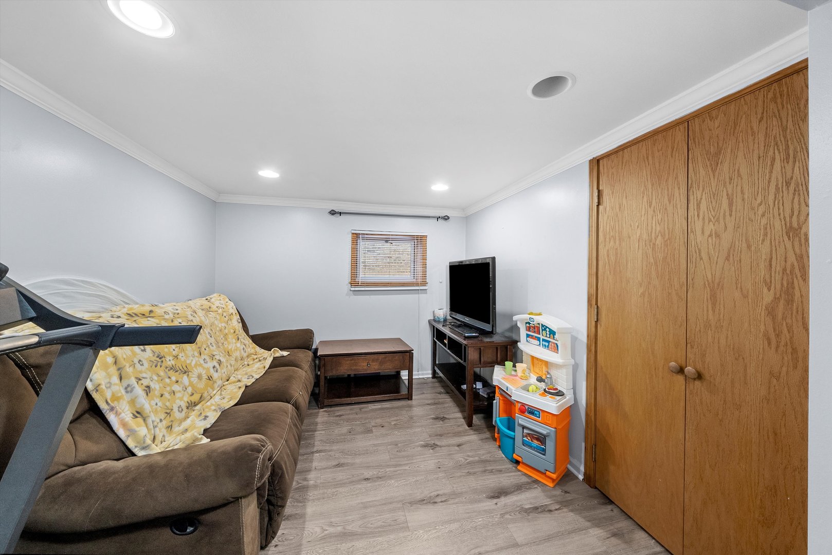 2716 Grove Avenue Berwyn, IL 60402 - Photo 26 of 46 a living room with furniture and a flat screen tv