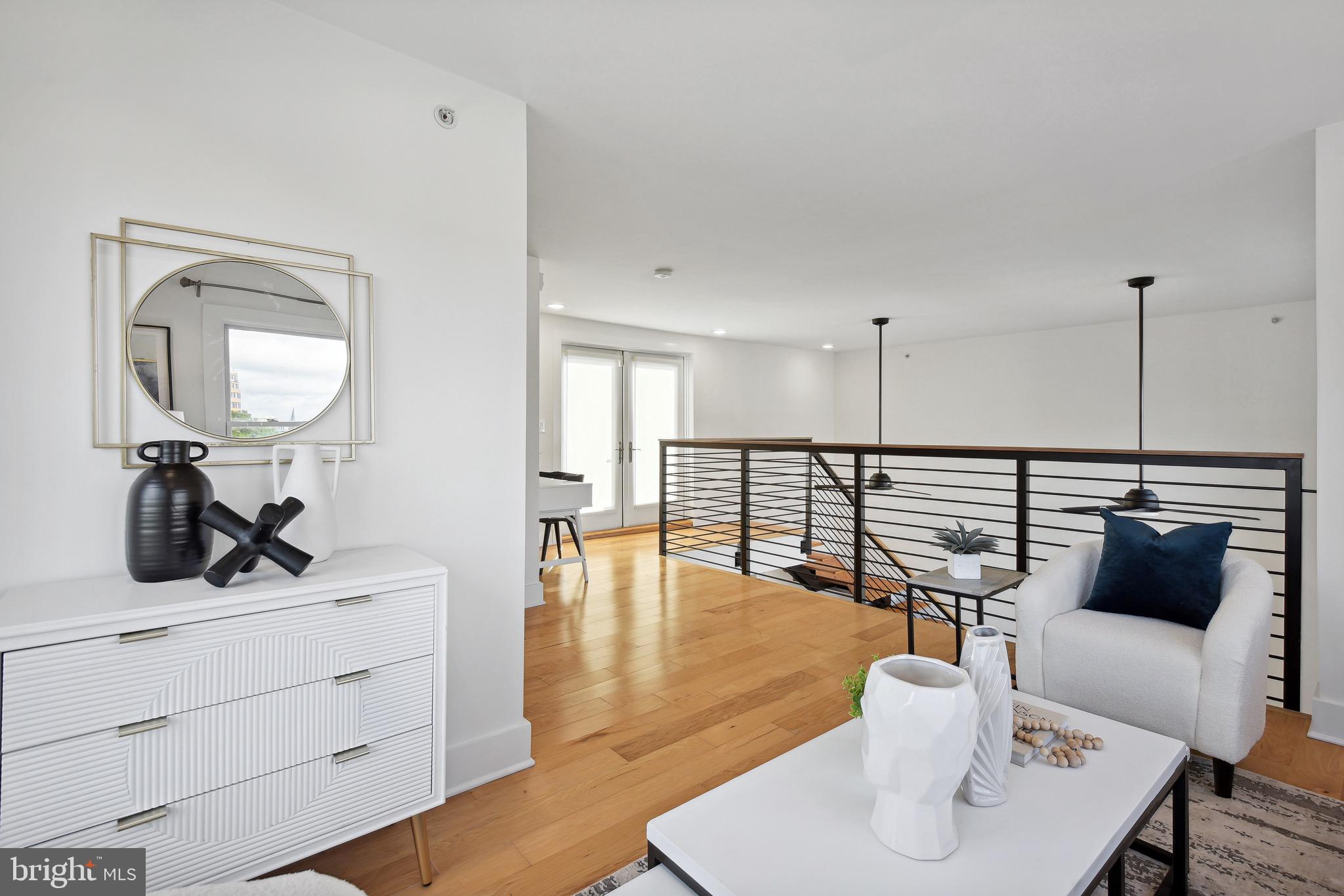 449 R Street Northwest, Unit 301 Washington, DC 20001 - Photo 20 of 29 a hallway with a view of living room and wooden floor