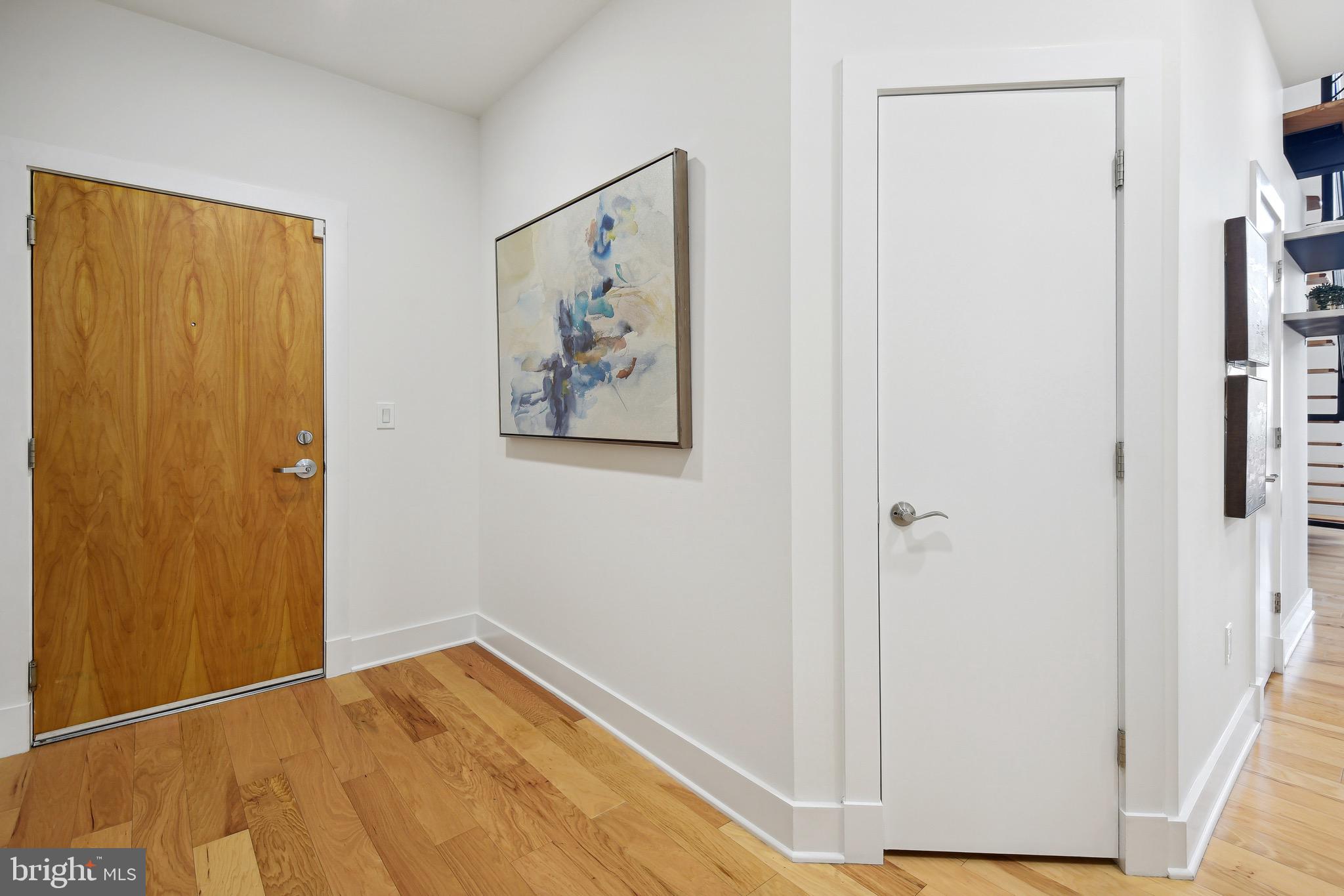 449 R Street Northwest, Unit 301 Washington, DC 20001 - Photo 2 of 29 a view of a bedroom with wooden floor and closet