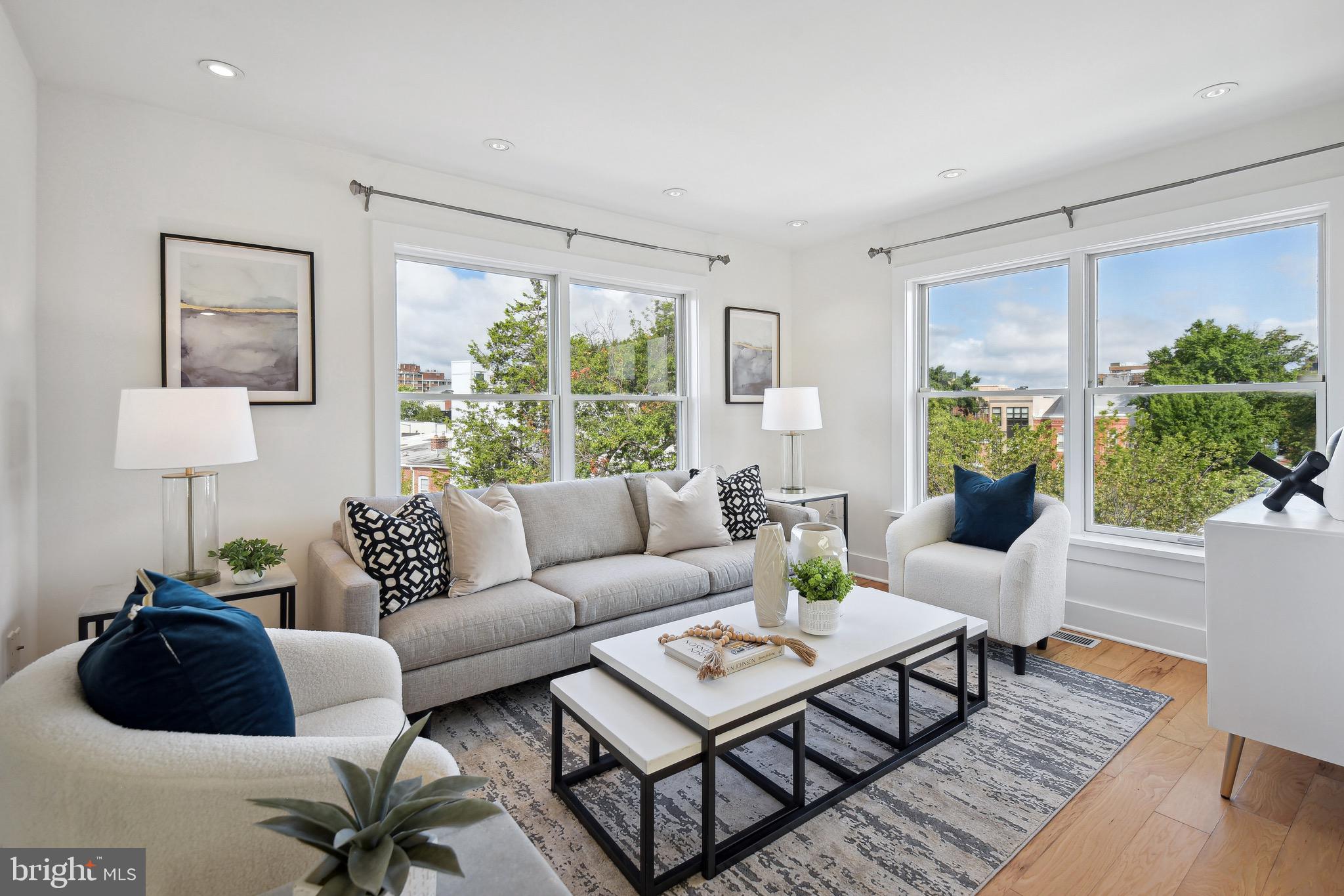 449 R Street Northwest, Unit 301 Washington, DC 20001 - Photo 22 of 29 a living room with furniture and a large window