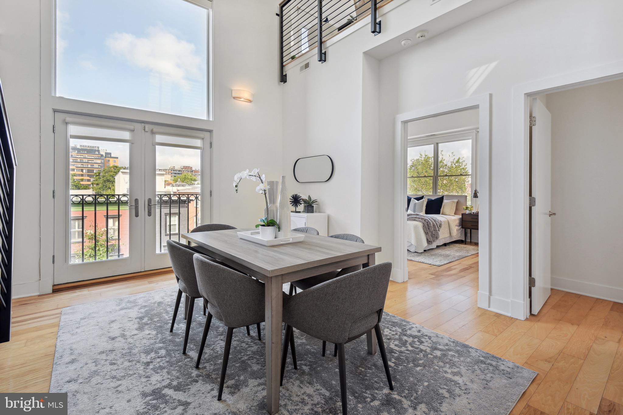 449 R Street Northwest, Unit 301 Washington, DC 20001 - Photo 9 of 29 a view of a dining room with furniture and wooden floor
