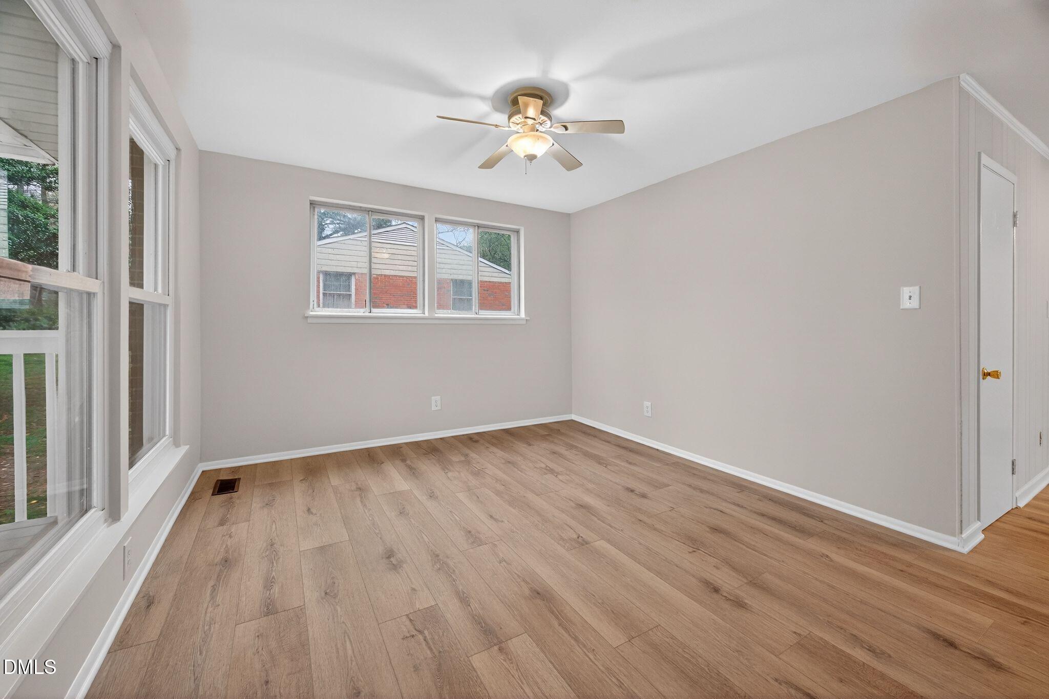 765 Bunche Drive Raleigh, NC 27610 - Photo 12 of 24 wooden floor in an empty room with a window