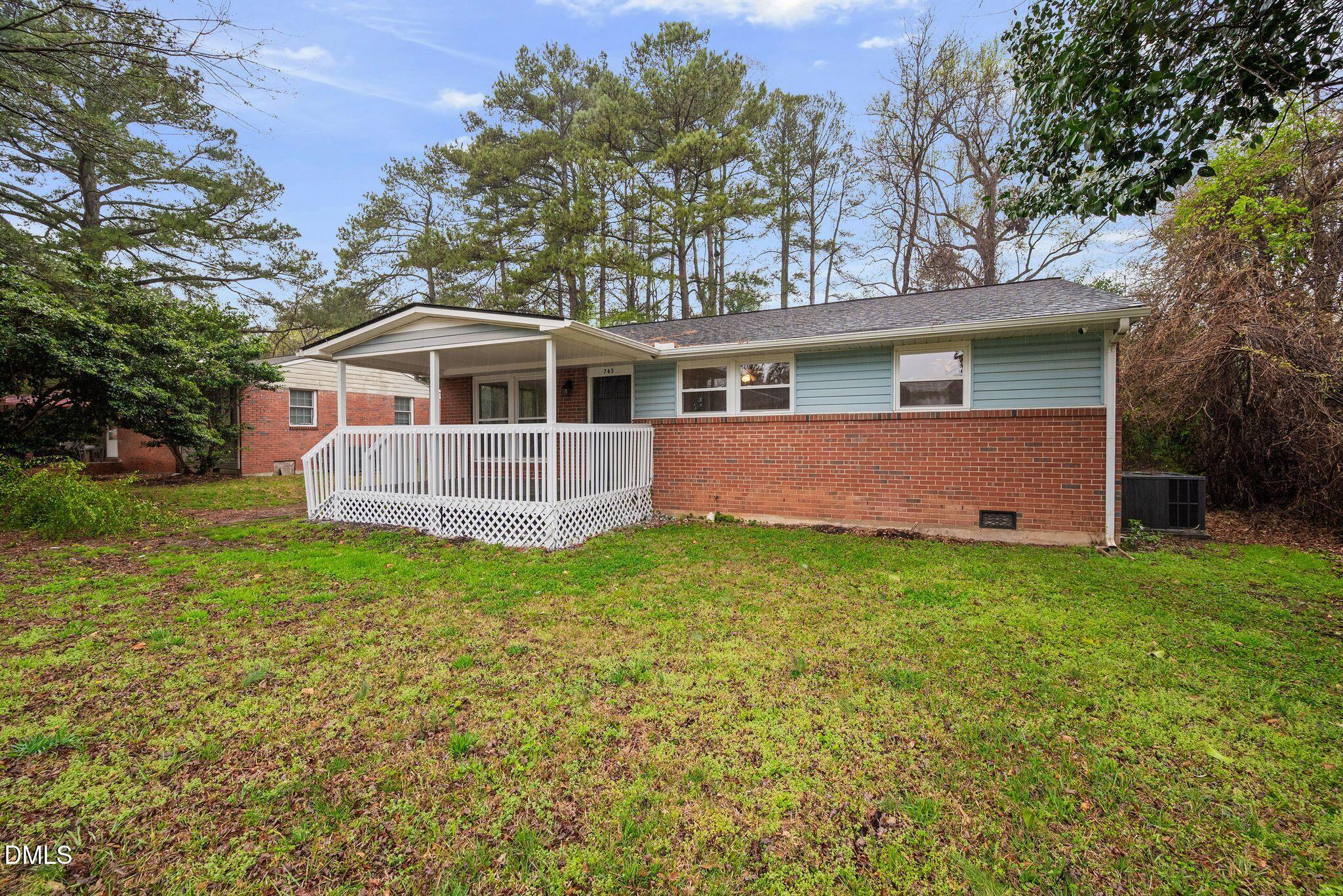 765 Bunche Drive Raleigh, NC 27610 - Photo 2 of 24 a front view of house with yard and green space