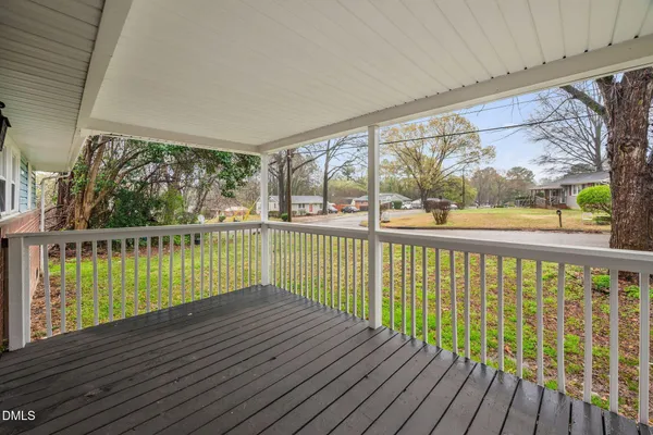 a view of balcony with wooden floor