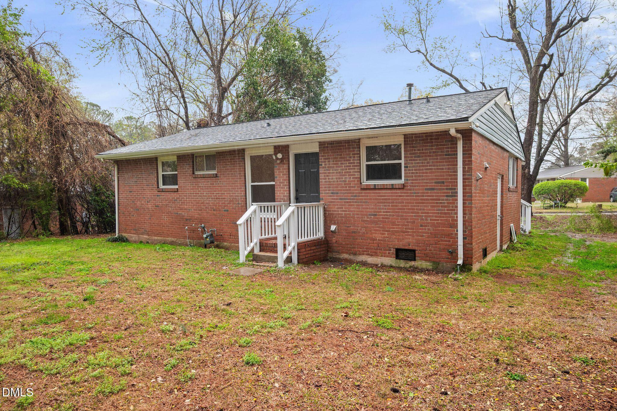 765 Bunche Drive Raleigh, NC 27610 - Photo 9 of 24 a view of a house with a yard and chairs