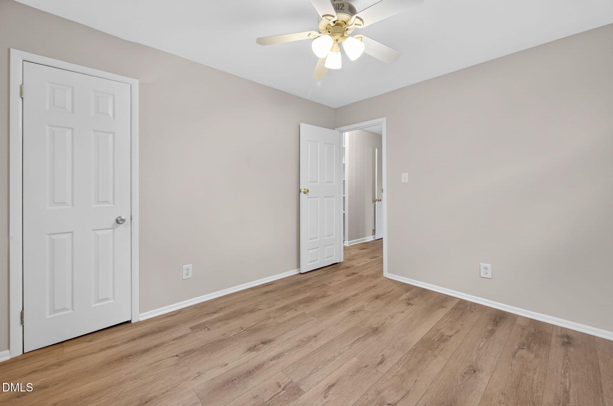 765 Bunche Drive Raleigh, NC 27610 - Photo 10 of 24 a view of an empty room with wooden floor