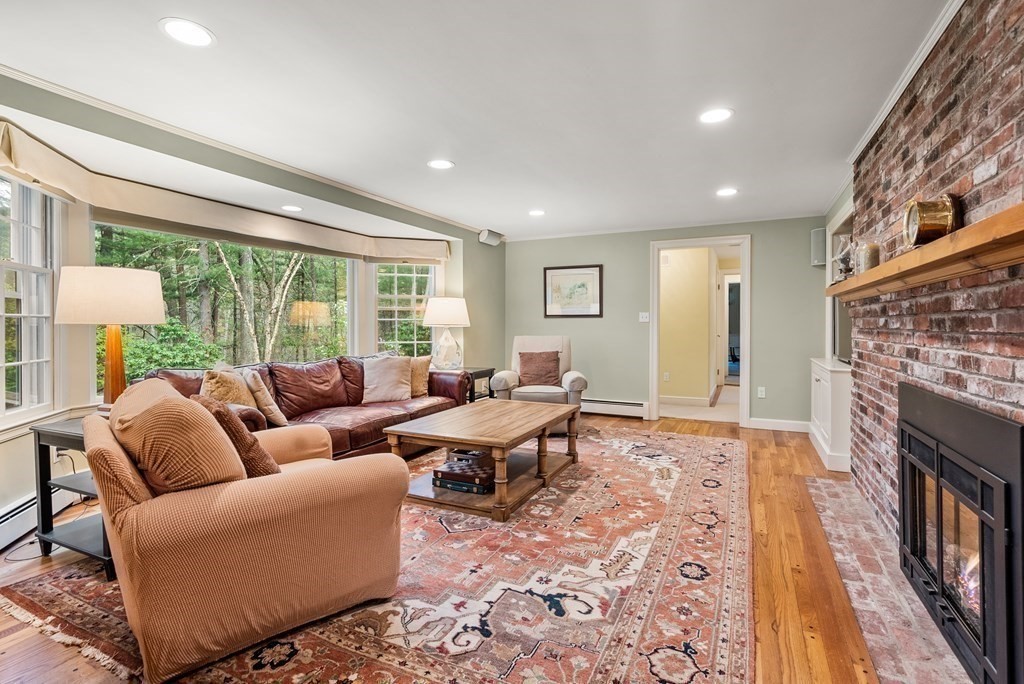 70 Cherry Brook Road Weston, MA 02493 - Photo 17 of 32 a living room with furniture fireplace and a large window