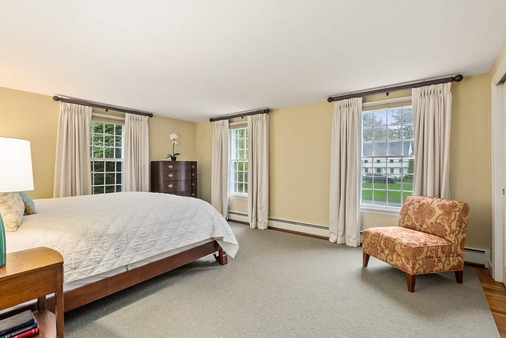 70 Cherry Brook Road Weston, MA 02493 - Photo 18 of 32 a bed sitting in a spacious bedroom next to a window