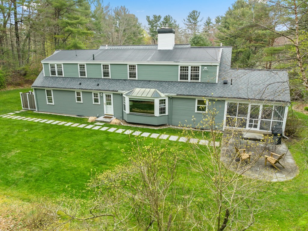 70 Cherry Brook Road Weston, MA 02493 - Photo 2 of 32 a front view of a house with a yard