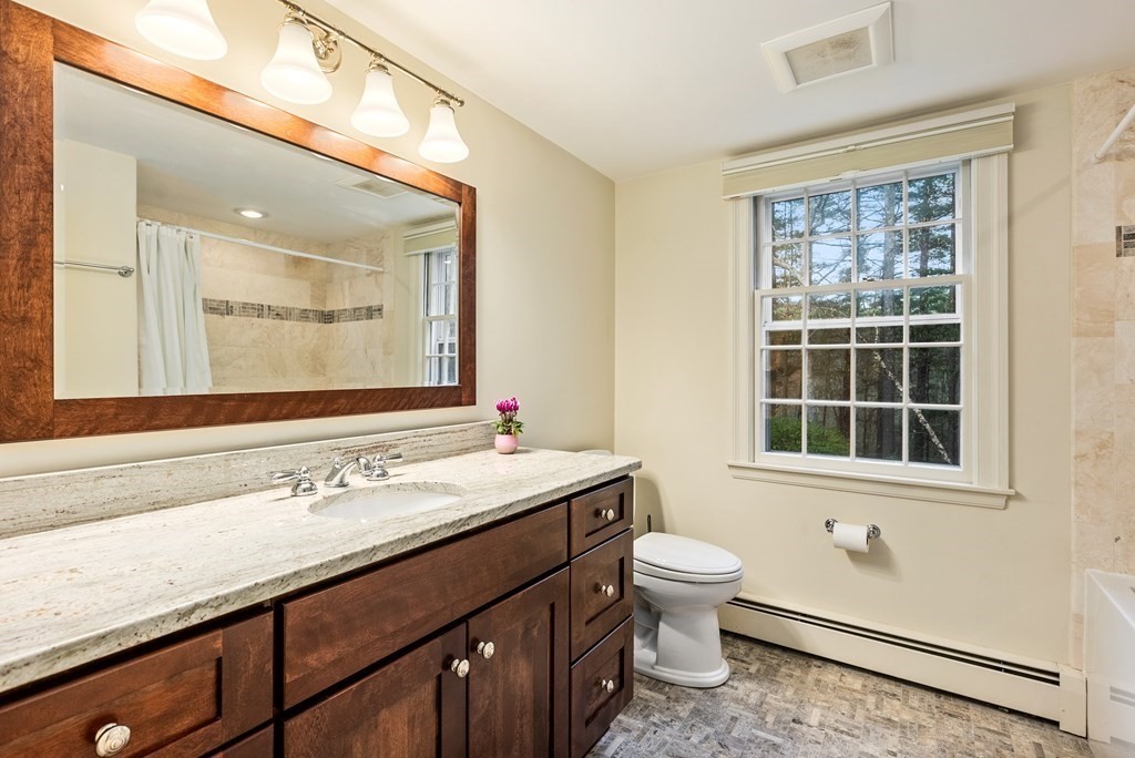 70 Cherry Brook Road Weston, MA 02493 - Photo 21 of 32 a bathroom with a sink a toilet and a window
