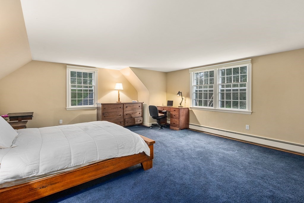 70 Cherry Brook Road Weston, MA 02493 - Photo 26 of 32 a bedroom with a bed and a large window