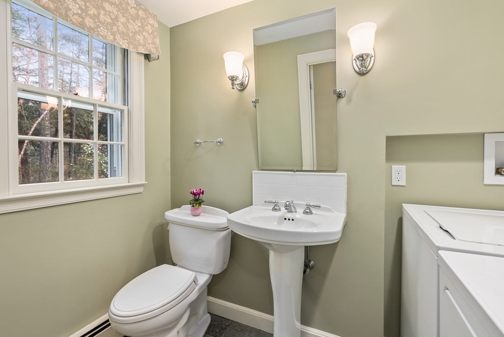 70 Cherry Brook Road Weston, MA 02493 - Photo 28 of 32 a bathroom with a sink mirror toilet and next to a window