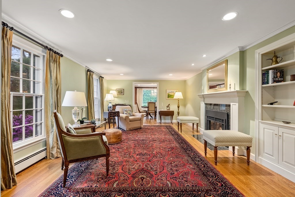 70 Cherry Brook Road Weston, MA 02493 - Photo 4 of 32 a living room with furniture fireplace and a table