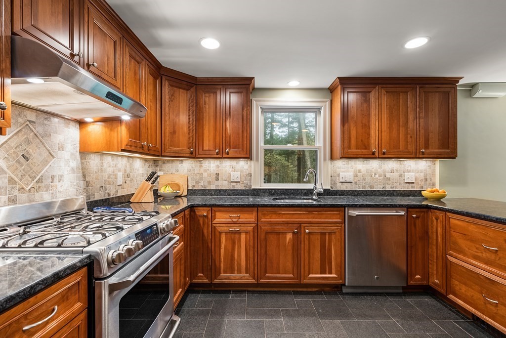 70 Cherry Brook Road Weston, MA 02493 - Photo 7 of 32 a kitchen with a sink stove top oven and cabinets