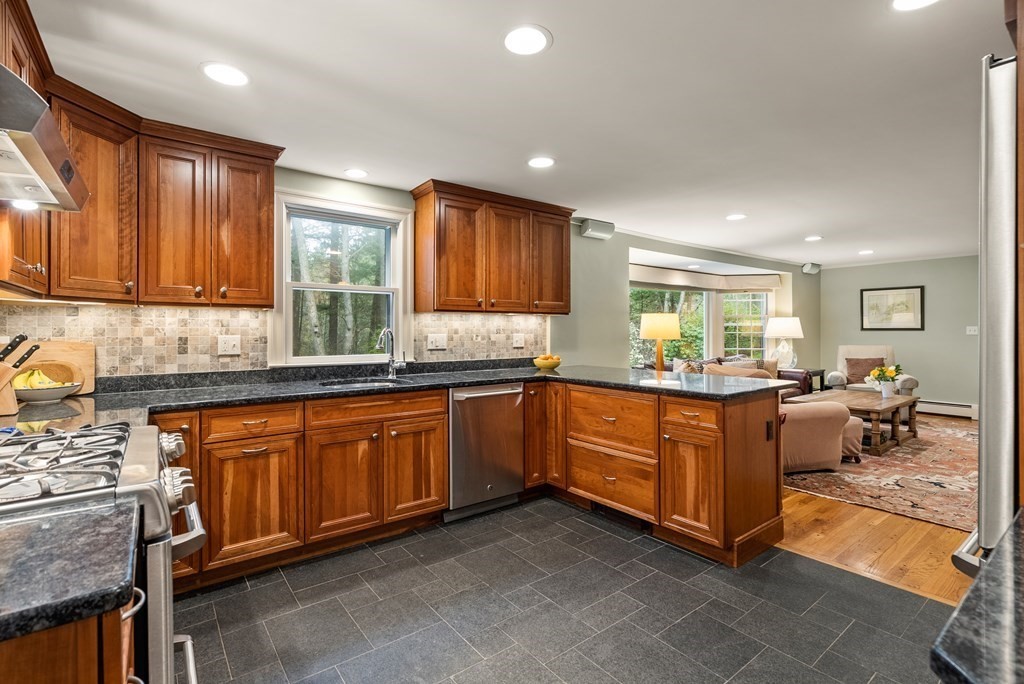 70 Cherry Brook Road Weston, MA 02493 - Photo 8 of 32 a kitchen with granite countertop sink cabinets and window