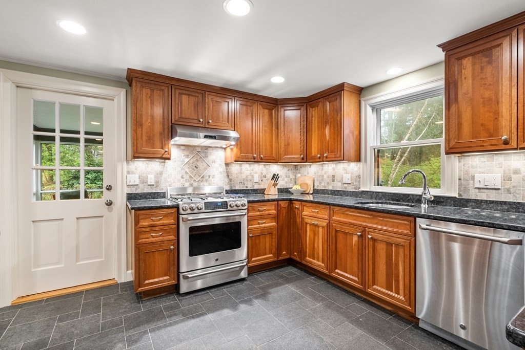 70 Cherry Brook Road Weston, MA 02493 - Photo 9 of 32 a kitchen with stainless steel appliances granite countertop a stove and a sink