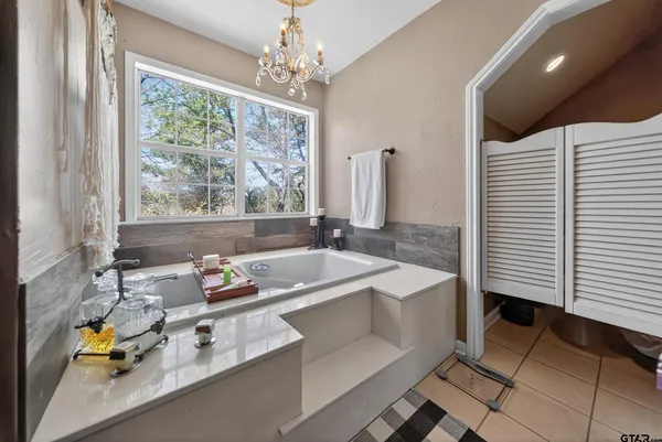 a bath tub sitting next to a window