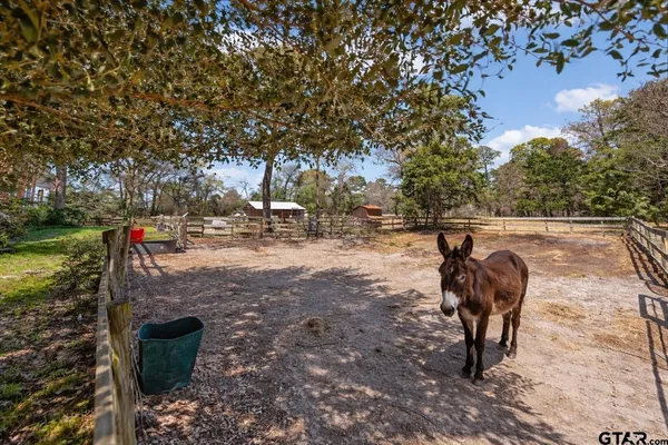 a view of a backyard with sitting area