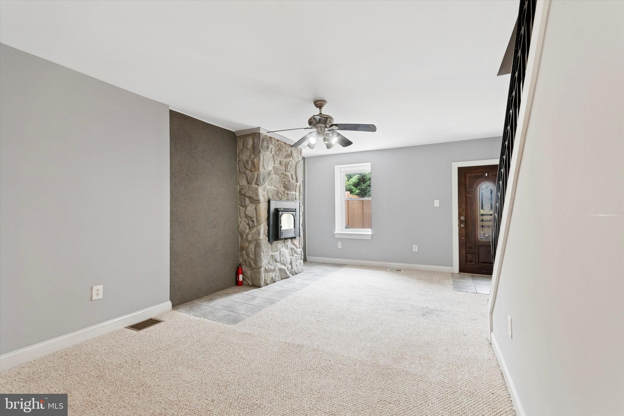 273 Delmar Street Philadelphia, PA 19128 - Photo 13 of 34 an empty room with chandelier fan and windows