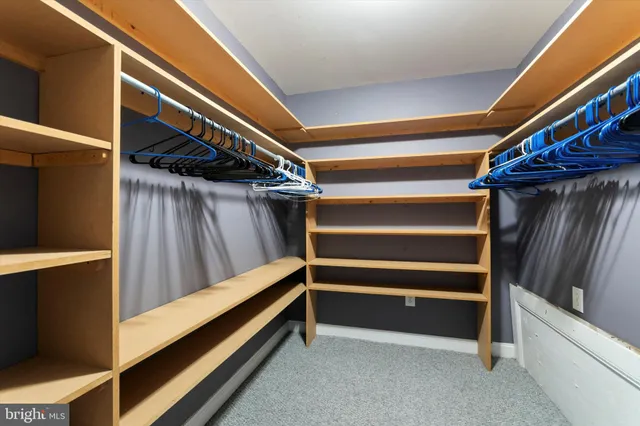a view of walk in closet with stairs