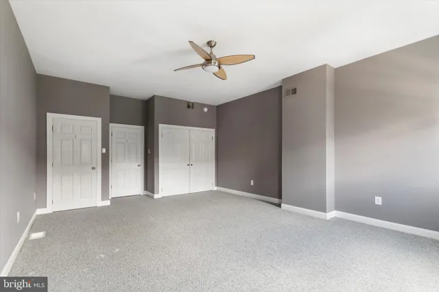 a view of a livingroom with a ceiling fan