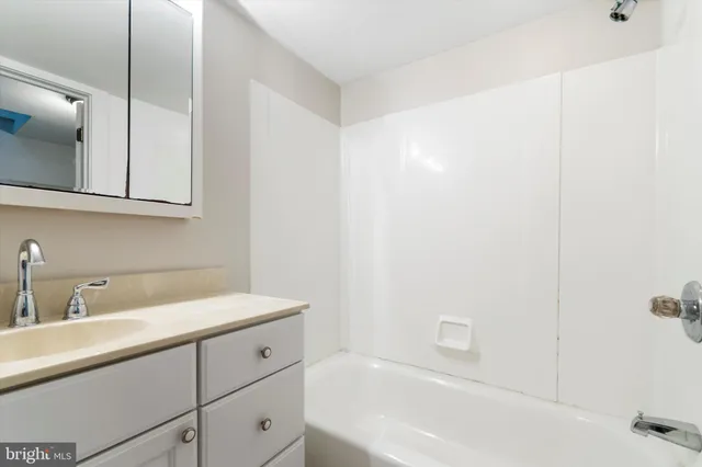 a bathroom with a sink a vanity and mirror