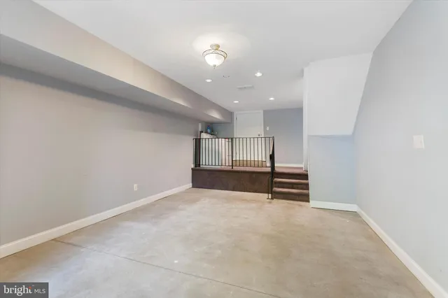 a view of empty room with stairs and ventilation