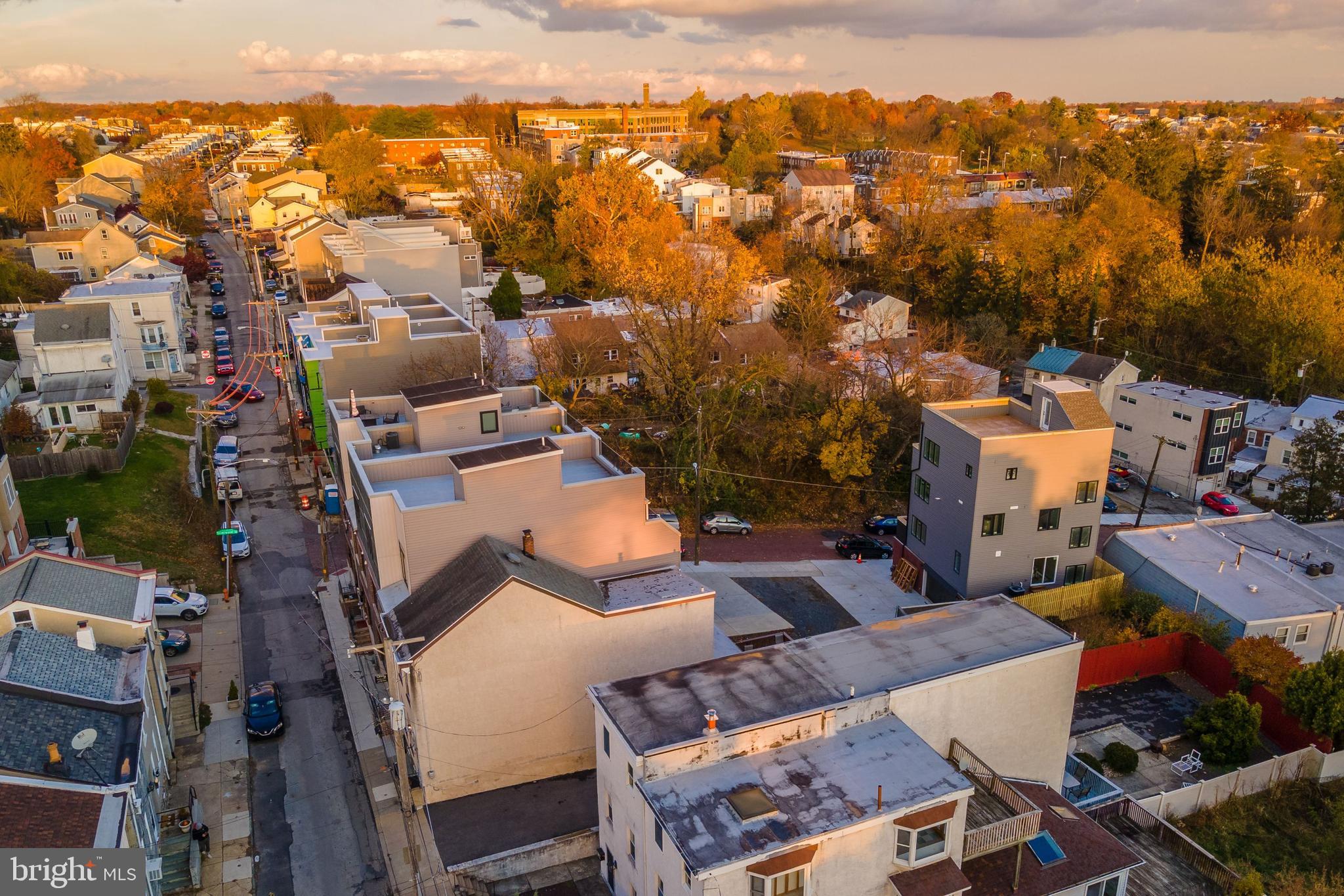 273 Delmar Street Philadelphia, PA 19128 - Photo 7 of 34 an aerial view of a city with lots of residential buildings and mountain view in back