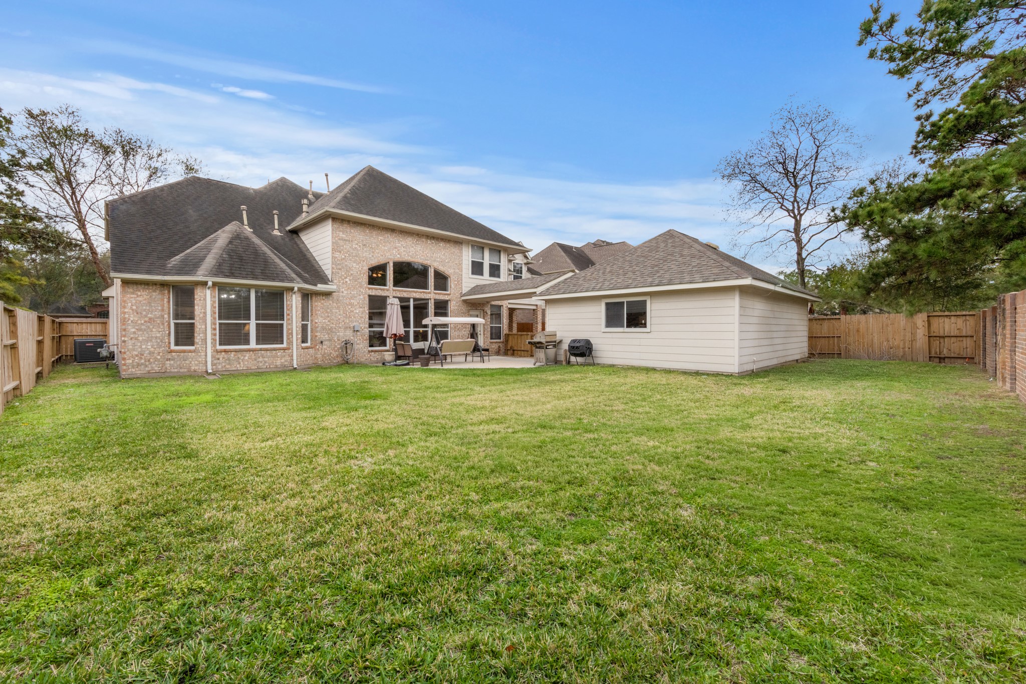 9510 Ashdown Forest Drive Spring, TX 77379 - Photo 39 of 50 BACKYARD – generous backyard with open lawn space perfect for outdoor activities, pets, or gardening. The fenced yard offers privacy and room to enjoy the outdoors.