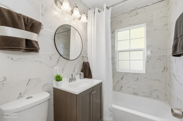 a bathroom with a sink a toilet and a bathtub