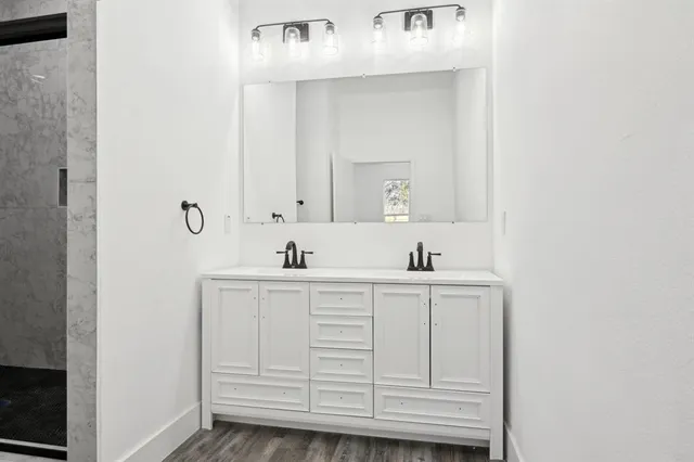 a bathroom with a sink and a mirror