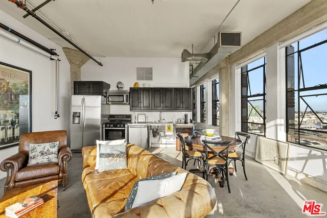 a living room with furniture fireplace and flat screen tv