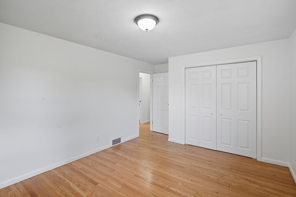 11 Copeland Street Springfield, MA 01108 - Photo 14 of 27 a view of an empty room with wooden floor