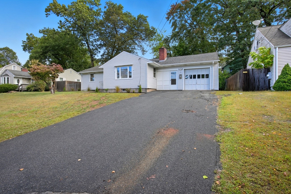 11 Copeland Street Springfield, MA 01108 - Photo 2 of 27 a view of a house with a yard and wooden fence