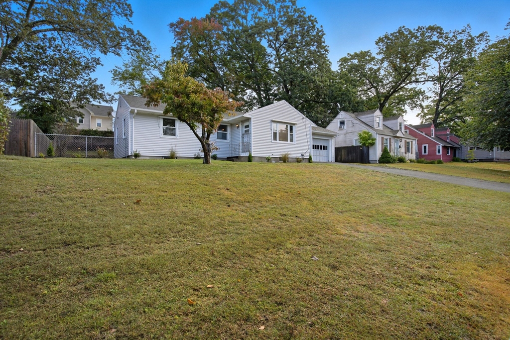 11 Copeland Street Springfield, MA 01108 - Photo 3 of 27 a front of a house with a yard