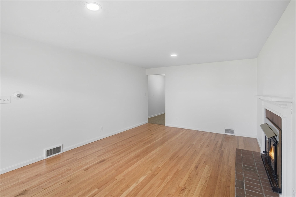 11 Copeland Street Springfield, MA 01108 - Photo 5 of 27 a view of empty room with wooden floor and fan
