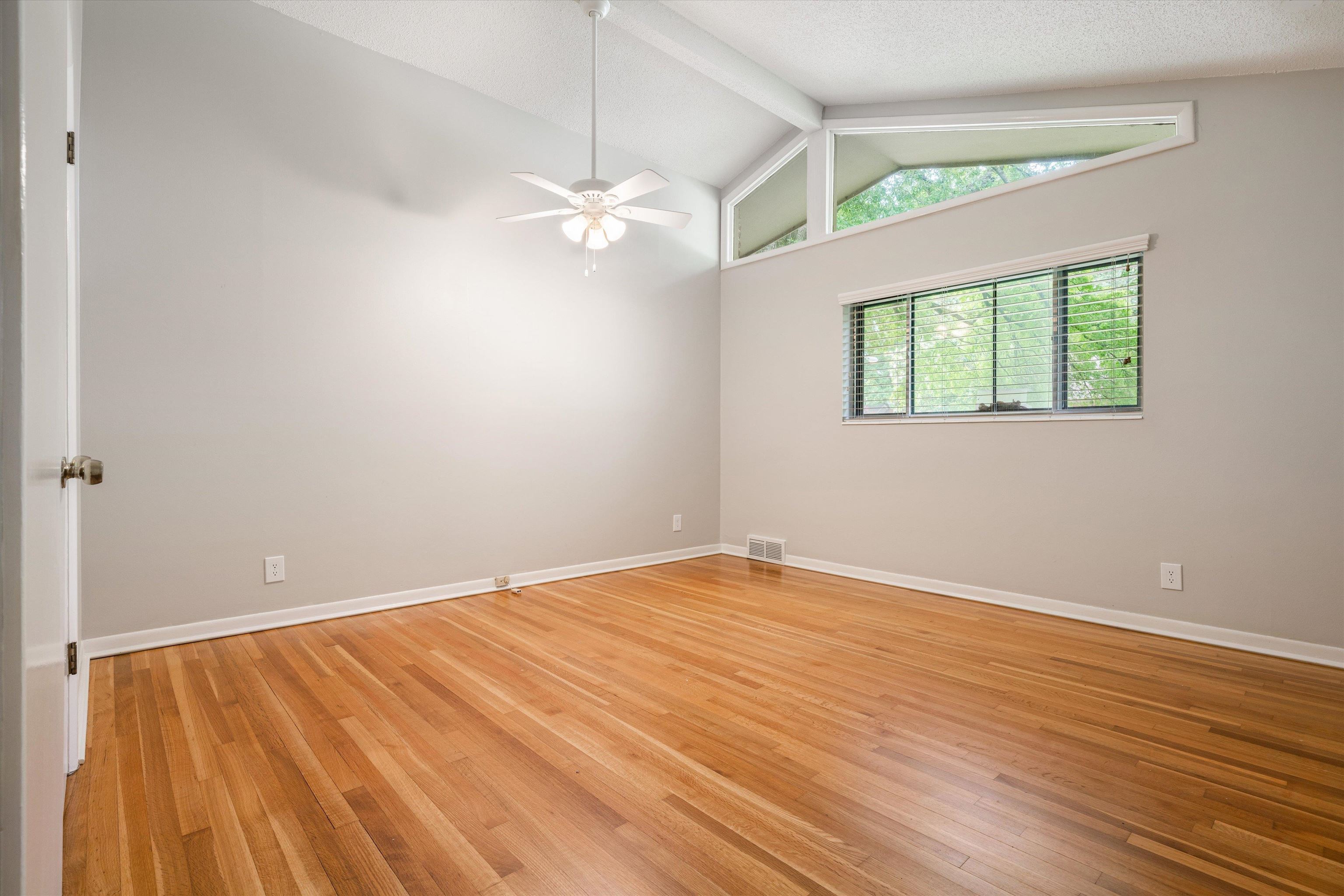 5670 North Angela Road Memphis, TN 38120 - Photo 15 of 22 wooden floor in an empty room with a window