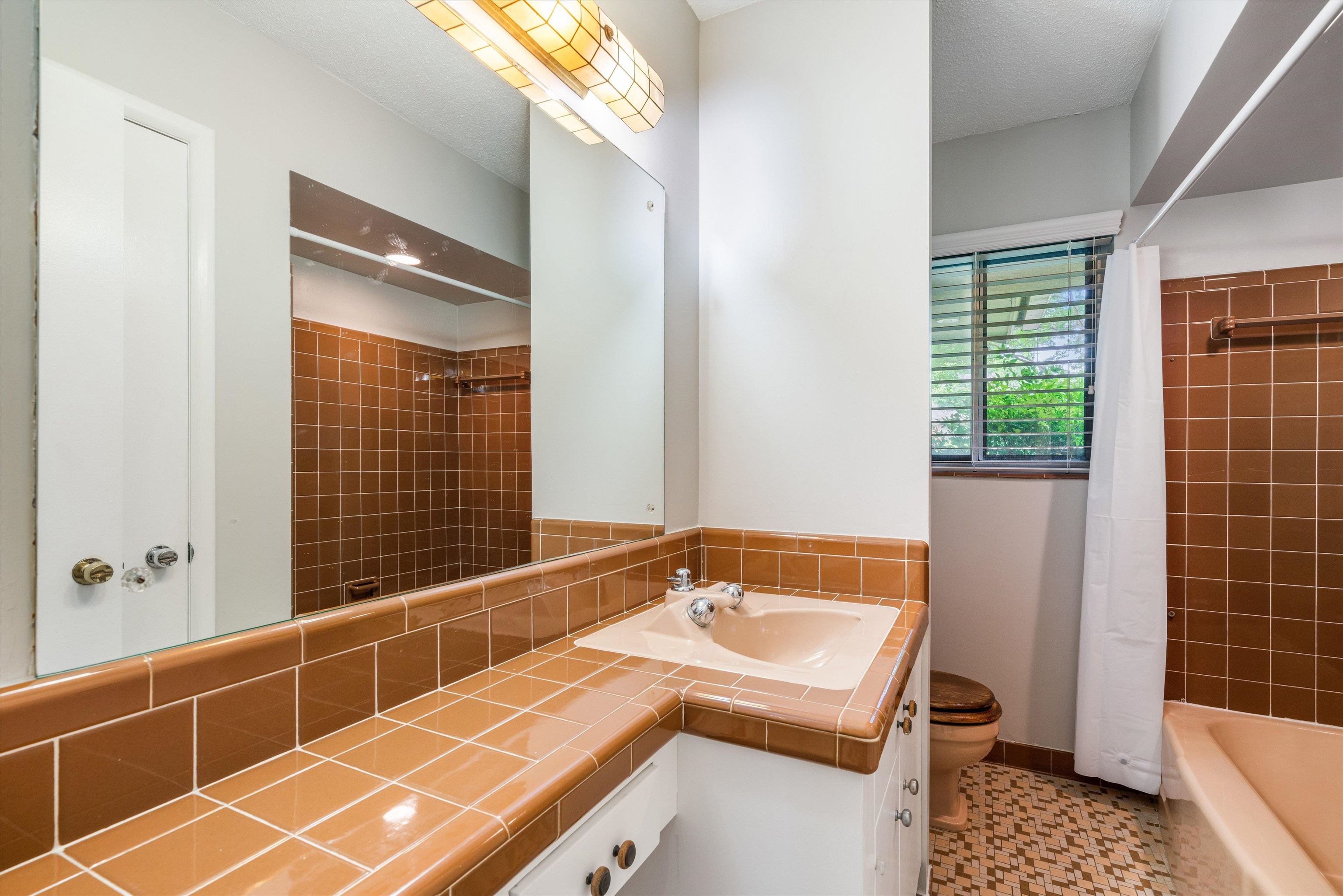5670 North Angela Road Memphis, TN 38120 - Photo 16 of 22 a bathroom with a sink and a shower