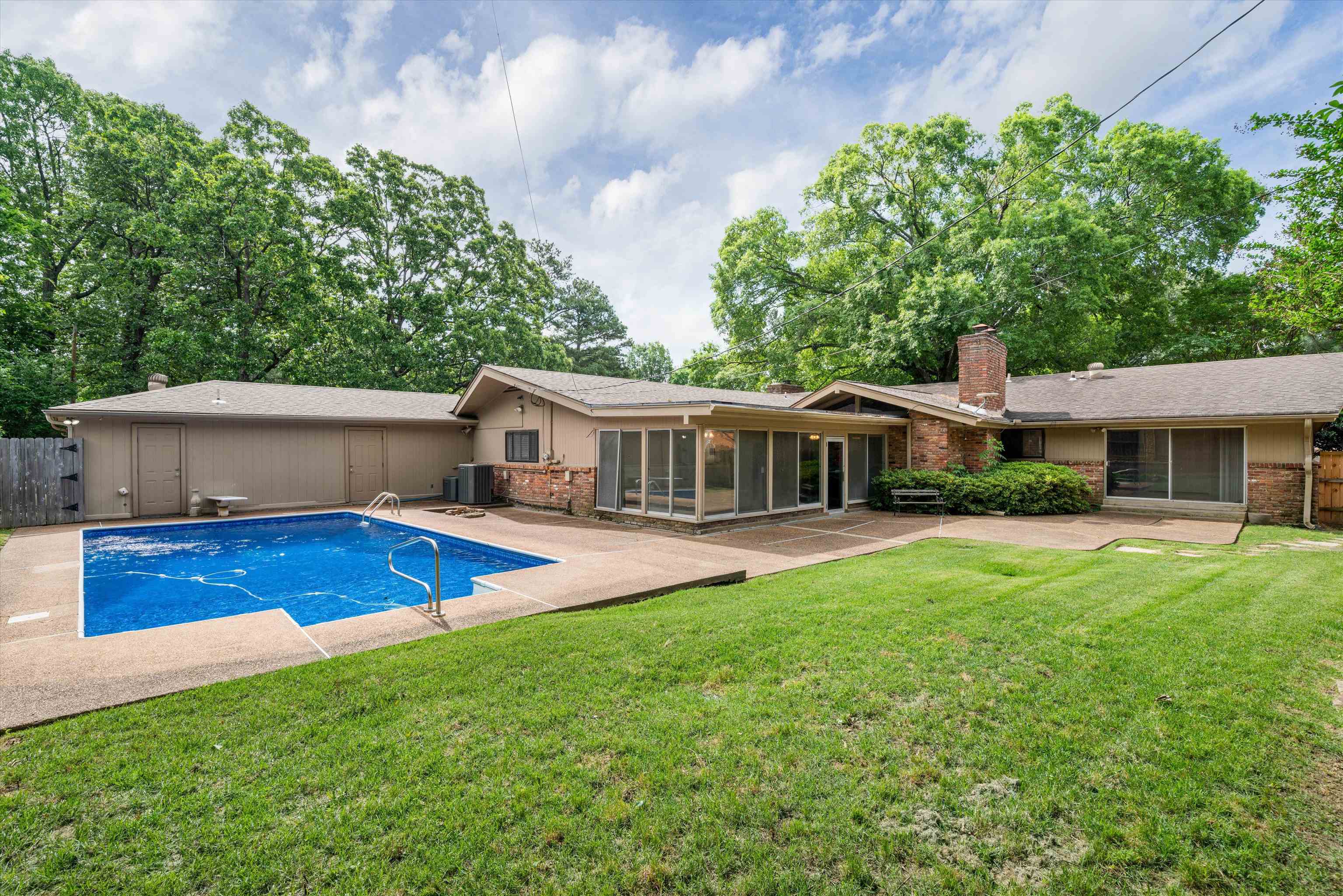 5670 North Angela Road Memphis, TN 38120 - Photo 21 of 22 a view of a house with pool and porch with a yard