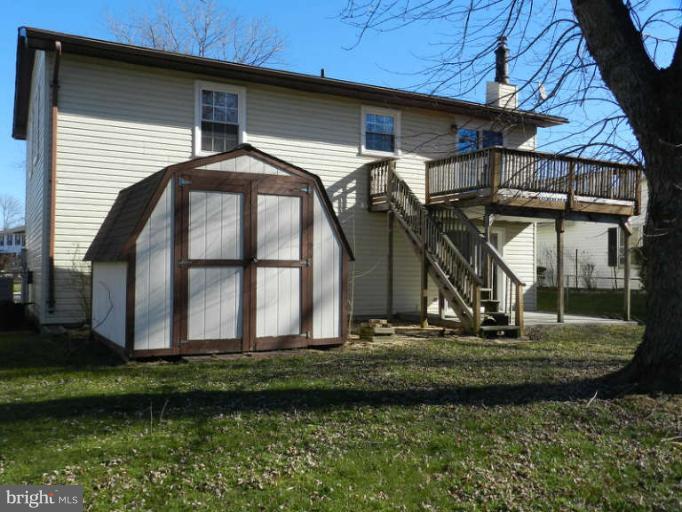 1849 Montreal Road Severn, MD 21144 - Photo 22 of 23 a front view of a house with a yard