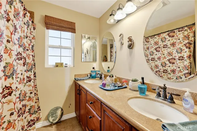 a bathroom with a sink toilet and mirror