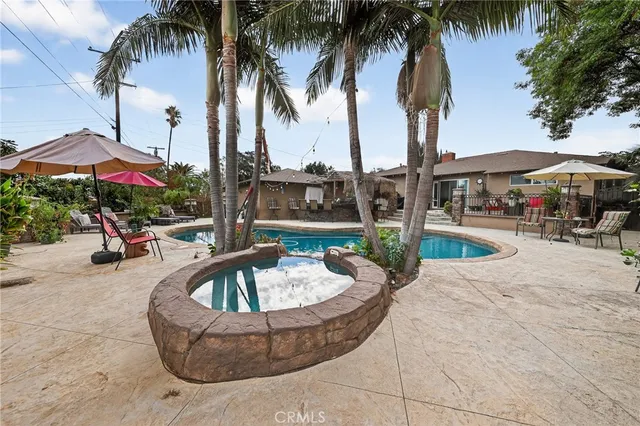 a view of a swimming pool with chairs