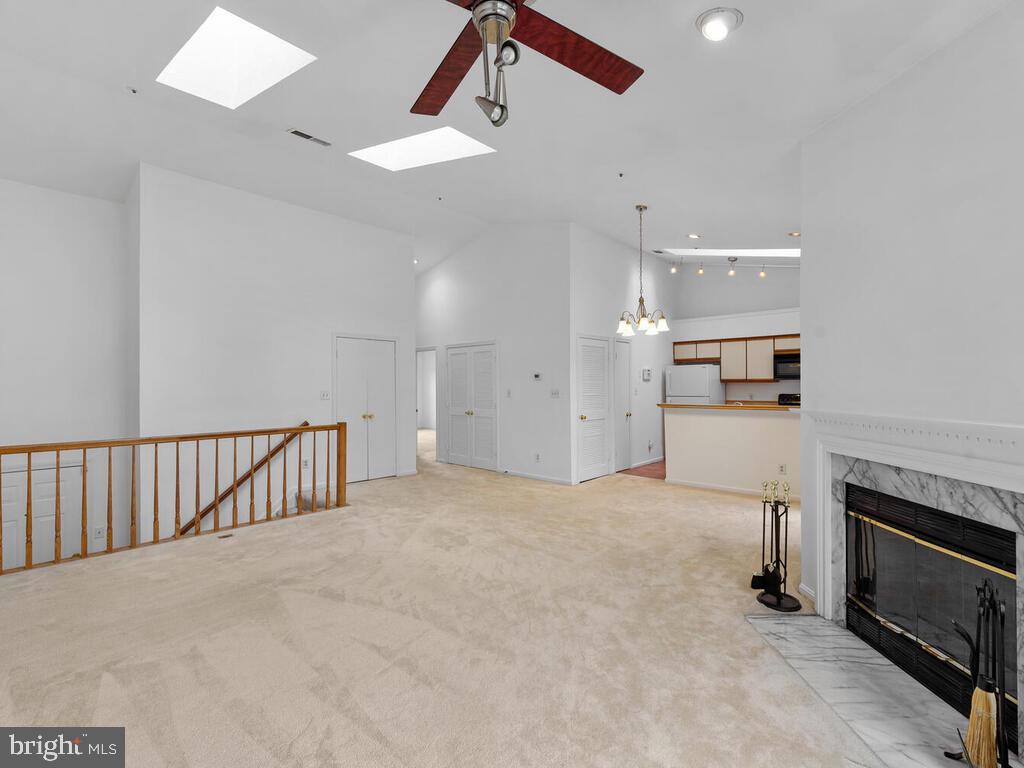 7806 Spinnaker Road, Unit 523 Laurel, MD 20707 - Photo 2 of 33 Living room w/ wood burning FP & dining area