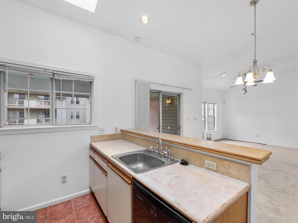7806 Spinnaker Road, Unit 523 Laurel, MD 20707 - Photo 15 of 33 Kitchen w/ skylights & eat in bar area
