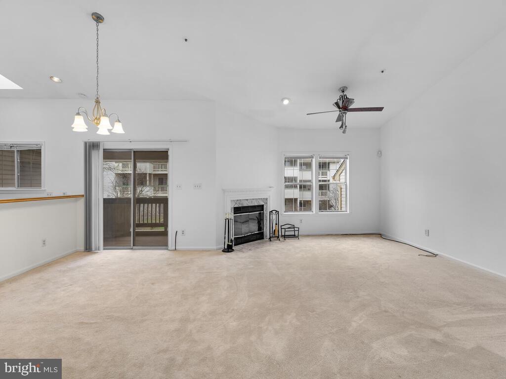 7806 Spinnaker Road, Unit 523 Laurel, MD 20707 - Photo 3 of 33 Living rm w/ wood FP, vaulted ceilings