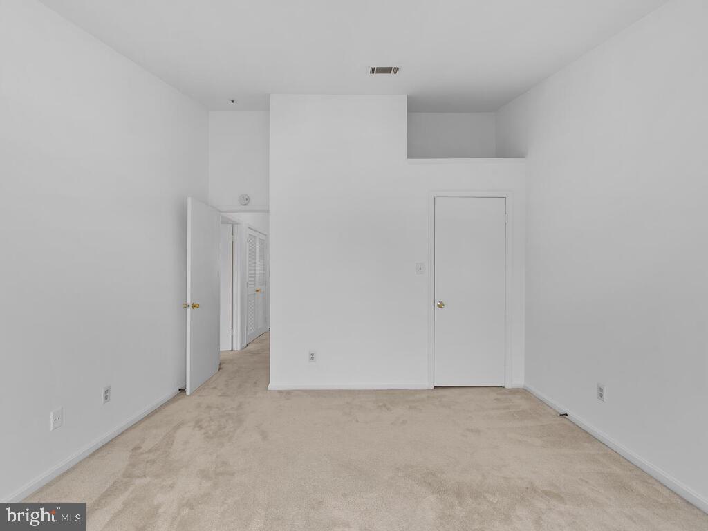 7806 Spinnaker Road, Unit 523 Laurel, MD 20707 - Photo 27 of 33 2nd bedroom w/ vaulted ceilings & plant shelve