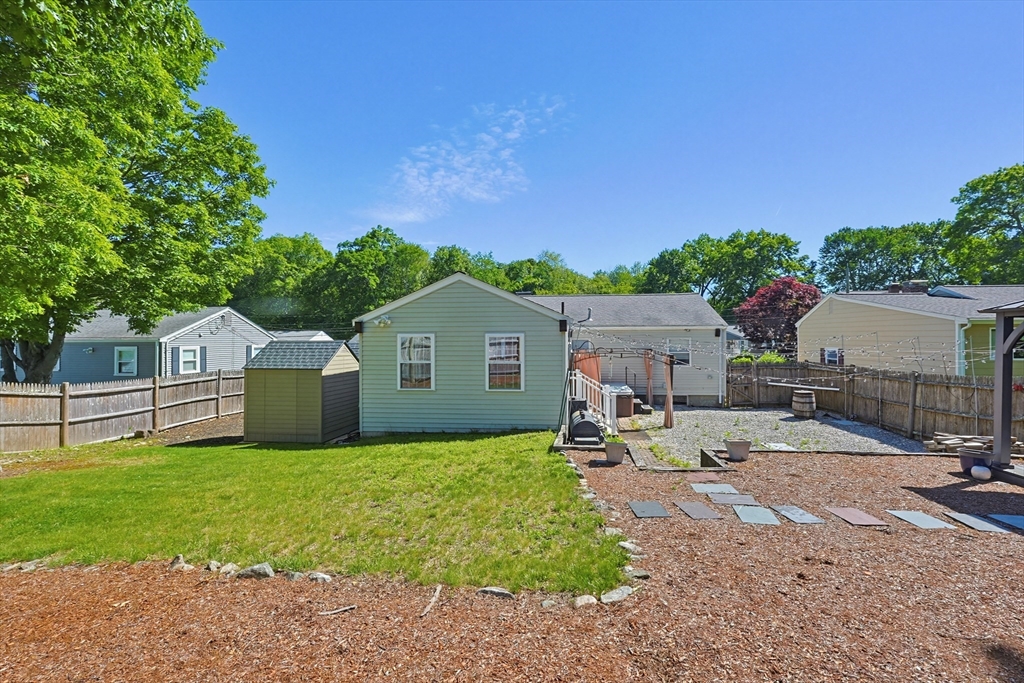 118 Spruce Road Norwood, MA 02062 - Photo 36 of 39 a view of a house with a yard and large tree